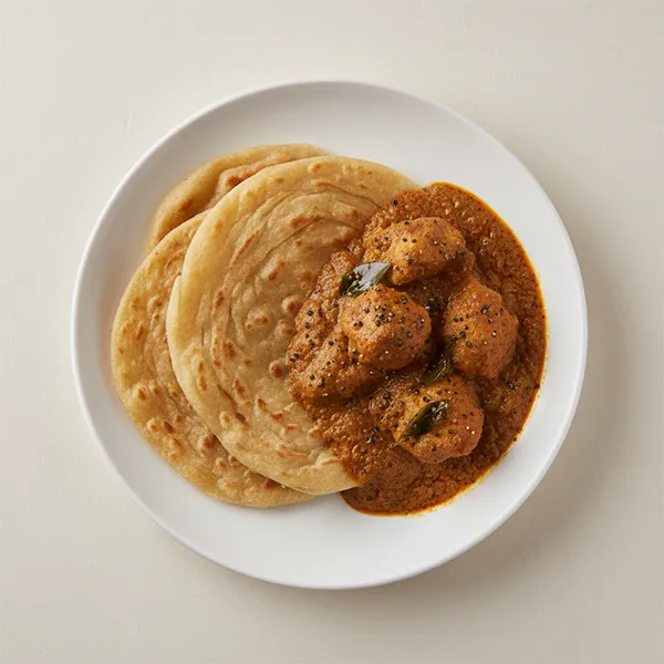 Madras Pepper Chicken Curry With Parotta